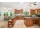 Spacious kitchen features tile floors, an eat-in area, and abundant countertop space at 6868 St Peters Ln, Matthews, NC 28105