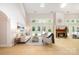 Spacious living room with vaulted ceilings, gas fireplace, and abundant natural light at 6868 St Peters Ln, Matthews, NC 28105