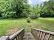 View of the home's green backyard from the back deck at 745 Old Charlotte Sw Rd, Concord, NC 28027
