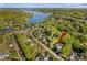 Scenic aerial view of a neighborhood home near a beautiful lake surrounded by lush greenery at 7896 Harbor Master Ct, Denver, NC 28037
