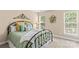 Comfortable bedroom with a metal bed frame, decorative wall art, and natural light at 7896 Harbor Master Ct, Denver, NC 28037