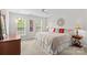 Bright bedroom featuring neutral walls, carpet, and a well-lit window at 7896 Harbor Master Ct, Denver, NC 28037