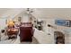 Cozy bonus room with a ceiling fan, comfortable seating, and a large television, perfect for relaxing and entertaining at 7896 Harbor Master Ct, Denver, NC 28037