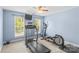 Bright exercise room featuring a treadmill, elliptical, and natural light from windows at 7896 Harbor Master Ct, Denver, NC 28037