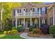 Charming brick home showcasing a welcoming front entrance with landscaped garden and manicured walkway at 7896 Harbor Master Ct, Denver, NC 28037