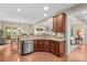 Open kitchen featuring granite countertops, wooden cabinets, stainless steel appliances, and hardwood floors at 7896 Harbor Master Ct, Denver, NC 28037