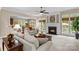 Inviting living room featuring a fireplace, large windows, neutral decor, and an open floor plan at 7896 Harbor Master Ct, Denver, NC 28037
