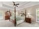 Elegant main bedroom featuring a four-poster bed, neutral decor, and classic furnishings at 7896 Harbor Master Ct, Denver, NC 28037