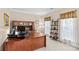 Bright office space featuring a built-in desk and shelving, natural light, and a neutral color palette at 7896 Harbor Master Ct, Denver, NC 28037