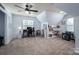 Spacious bonus room with ample lighting, a desk area, and built-in bookshelves at 7905 Sedgebrook E Dr, Stanley, NC 28164