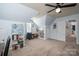 Bright and airy bonus room featuring built-in bookcases and plenty of open space at 7905 Sedgebrook E Dr, Stanley, NC 28164