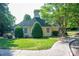 Charming yellow clubhouse with well-manicured lawn and mature trees, offering a welcoming community space at 7905 Sedgebrook E Dr, Stanley, NC 28164