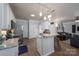 This kitchen is fully equipped with stainless steel appliances, marble countertops, and an island with seating at 7905 Sedgebrook E Dr, Stanley, NC 28164