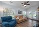Inviting living area with large windows and a walk-out patio for comfortable living at 7905 Sedgebrook E Dr, Stanley, NC 28164