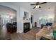 Beautiful living room featuring hardwood floors, a marble fireplace, and large windows for natural light at 7905 Sedgebrook E Dr, Stanley, NC 28164