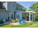 Backyard view of patio featuring colorful Adirondack chairs and covered dining area at 7905 Sedgebrook E Dr, Stanley, NC 28164