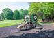Fun playground with a slide and climbing features, set in a safe, wood-chip play area at 7905 Sedgebrook E Dr, Stanley, NC 28164