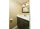 Bathroom featuring an undermount sink with a dark vanity and a mirror at 8835 Hunter Ridge Dr, Charlotte, NC 28226