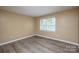 Bright bedroom with hardwood floors and a window at 8835 Hunter Ridge Dr, Charlotte, NC 28226