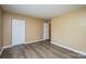 Simple bedroom with hardwood floors and a closet at 8835 Hunter Ridge Dr, Charlotte, NC 28226