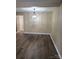 Spacious dining room with wood-look floors and modern lighting at 8835 Hunter Ridge Dr, Charlotte, NC 28226
