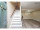 Welcoming foyer with staircase, new floors, and open access to the living area creating a seamless flow at 8835 Hunter Ridge Dr, Charlotte, NC 28226