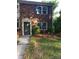 Traditional brick home with green shutters and well-kept landscaping creates a welcoming curb appeal at 8835 Hunter Ridge Dr, Charlotte, NC 28226