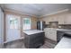 Kitchen featuring stainless steel appliances, an island, and an exterior door at 8835 Hunter Ridge Dr, Charlotte, NC 28226