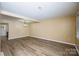 Large living area with modern flooring, fresh paint, and an open layout perfect for entertaining guests at 8835 Hunter Ridge Dr, Charlotte, NC 28226