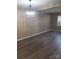Bright living room with wood-look floors and modern lighting at 8835 Hunter Ridge Dr, Charlotte, NC 28226