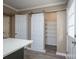 Walk-in pantry adjacent to kitchen and island featuring shelving units at 8835 Hunter Ridge Dr, Charlotte, NC 28226