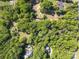 Aerial view of a lush wooded home lot with a pool, highlighting the generous space and privacy of the property at 8903 New Town Rd, Waxhaw, NC 28173