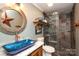 Unique bathroom featuring an artisan sink and a modern tile shower with glass doors at 8903 New Town Rd, Waxhaw, NC 28173