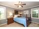 Cozy bedroom with two windows and warm lighting, creating a comfortable retreat at 8903 New Town Rd, Waxhaw, NC 28173