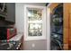 Well-lit kitchen area with a view of the exterior and convenient access to laundry facilities at 8903 New Town Rd, Waxhaw, NC 28173
