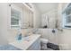 Accessible bathroom features walk-in tub, safety grab bars, and convenient single sink vanity at 910 E Center Ave, Mooresville, NC 28115