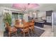 Cozy dining room featuring a unique pink ceiling, chandelier, and a patterned rug at 910 E Center Ave, Mooresville, NC 28115