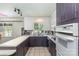 Functional kitchen with dual sink, oven and microwave with natural lighting from exterior at 910 E Center Ave, Mooresville, NC 28115