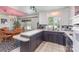 Bright eat-in kitchen features ample counter space, modern appliances, and a view to the dining room at 910 E Center Ave, Mooresville, NC 28115