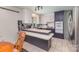 Cozy kitchen featuring white and gray cabinets, updated appliances, and eat in bar seating at 910 E Center Ave, Mooresville, NC 28115