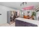 Spacious kitchen and dining area featuring stainless steel refrigerator and a bright pink ceiling at 910 E Center Ave, Mooresville, NC 28115