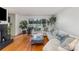 Bright living room featuring hardwood floors, a fireplace, and a comfortable sectional sofa at 910 E Center Ave, Mooresville, NC 28115