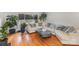 Bright living room featuring hardwood floors, a fireplace, and a comfortable sectional sofa at 910 E Center Ave, Mooresville, NC 28115