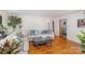 Comfortable living room features hardwood floors and neutral tones, creating a relaxing atmosphere at 910 E Center Ave, Mooresville, NC 28115