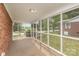 Inviting screened porch, perfect for enjoying the outdoors while staying protected from insects at 910 E Center Ave, Mooresville, NC 28115