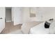 Minimal bedroom features neutral walls and floors, with natural light from the window at 9423 Weston Woods Ln, Charlotte, NC 28216