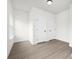 Bright, empty room, painted white with hardwood floors and natural light at 9423 Weston Woods Ln, Charlotte, NC 28216