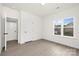 Bright, empty room featuring hardwood floors and a window with natural light at 9423 Weston Woods Ln, Charlotte, NC 28216