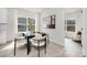 Modern dining area featuring a stylish table, seating, and natural light at 9423 Weston Woods Ln, Charlotte, NC 28216