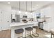 Stylish kitchen featuring a center island, pendant lighting, and stainless steel appliances at 9423 Weston Woods Ln, Charlotte, NC 28216